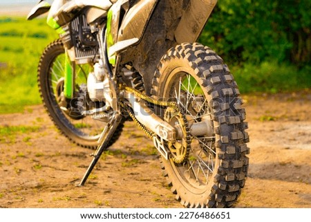 extreme cross enduro motorcycle is off-road. the rear wheel is in focus. part of a motorcycle. selective focus