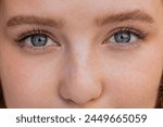 Extreme macro close-up portrait of face. Young adult beautiful pretty woman