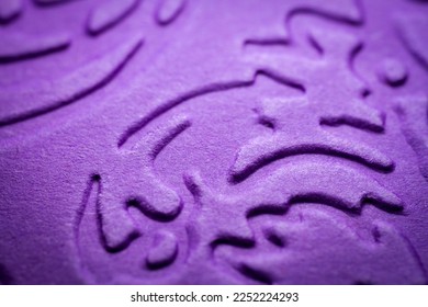 Extreme macro of embossed purple paper. Selective focus, shallow depth of field. - Shutterstock ID 2252224293