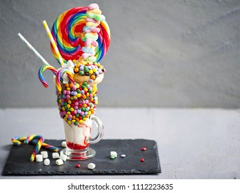 Extreme milkshake or freak shake . Copyspace,  strawberry freakshake with sweets  - Powered by Shutterstock