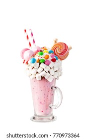 Extreme milkshake. Freakshake. Pink strawberry freakshake with sweets.The image is isolated. Selective focus.