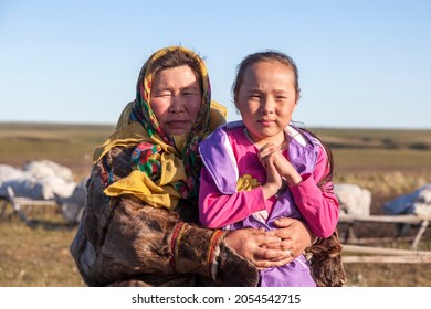 The extreme north, Yamal, the past of Nenets people, the dwelling of the peoples of the north, a family photo near the yurt in the tundra.Nadym, Russia, 06 July 2021