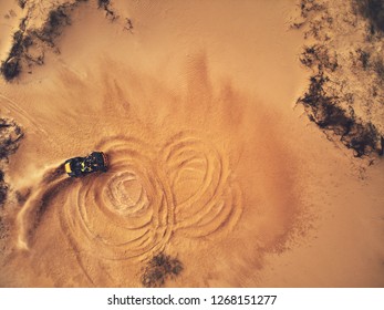 Extreme Sport. Quad Bike Riding On Sand In Desert Top View. Racing In Wild Nature 