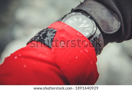 Extreme Sports and Expedition Timepiece on Mountain Hiker Wrist. Ultimate Analog Quartz Watch in Extreme Weather Conditions. Water Resistant.