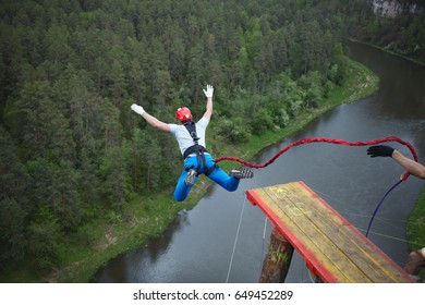 An extreme sportsman jumps on a rope from a great height. Ropejumping.