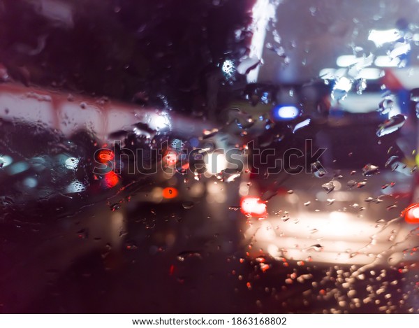 Extreme weather with raindrops on the glass on\
the streets of Aceh,\
Indonesia