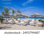 Extremely beautiful panorama of the promenade and beach of the city of Hersonissos (Χερσόνησος) bordering the Mediterranean and Aegean seas. Crete, Greece. Near the city of Heraklion and Malia