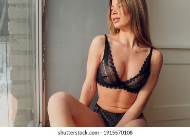 Extremely Beautiful And Young Adult Caucasian Woman Wearing Lingerie In A Boudoir Bedroom Setting In Various Poses.