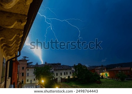 Extremely bright lightning flash during a thunderstorm near Lake Garda, Italy