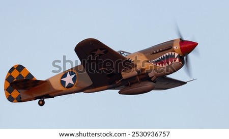 Extremely close side view of a WWII fighter plane (P-40 Warhawk) 