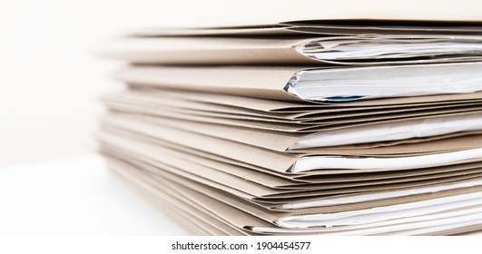 Extremely Close up Stack of Documents Folders on Office Desk Waiting to be Completed. - Shutterstock ID 1904454577