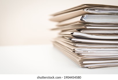 Extremely Close up Stack of Documents Folders on Office Desk Waiting to be Completed. - Shutterstock ID 1904454580
