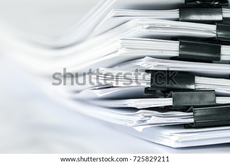 extremely close up  stacking of office working document with paper clip folder