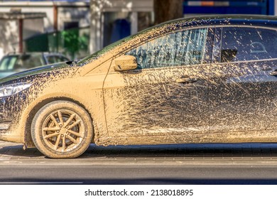 Extremely dirty car after driving on unrepaired damaged road