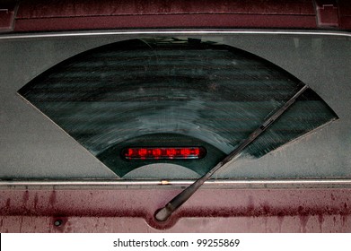Extremely Dirty Rear Car Windshield With Wiper