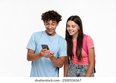 Extremely happy high school pupils students teenagers classmates boy girl friends in casual with bags holding smart cell phone using mobile app looking at screen isolated on white background - Powered by Shutterstock