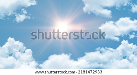 Extremely hot weather. Summer noon sun shines overhead. bottom up view of sky and clouds.