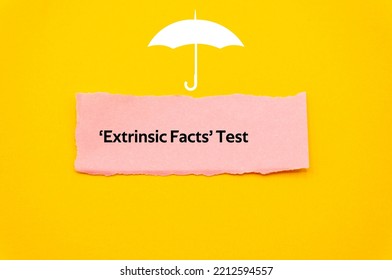 Extrinsic Facts Test.The Word Is Written On A Slip Of Colored Paper. Insurance Terms, Health Care Words, Life Insurance Terminology. Business Buzzwords.