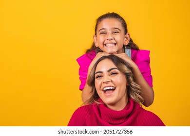 Extroverted sisters making poses and expressions on yellow background on brother's day. brother's day concept - Shutterstock ID 2051727356