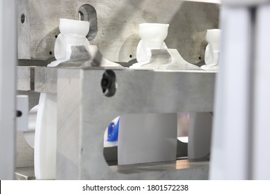 Extrusion Blow Moulding Process For Making White Plastic Bottle 