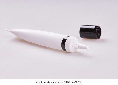 Eye Base Tube With Cream, Foundation, Concealer Isolated On White Background