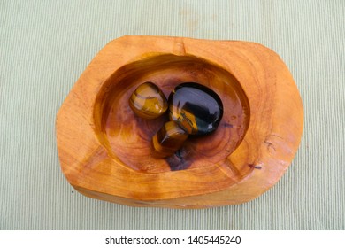 Tiger’s Eye And Hawk’s Eye, Brown Precious Stones Inside A Wooden Container Viewed From Above, Collector’s Items