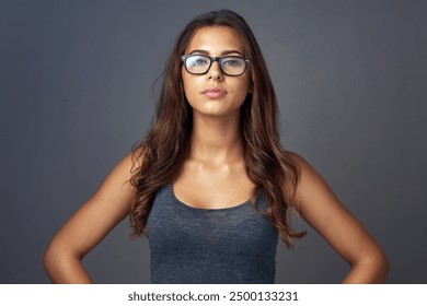 Eye care, woman and portrait on studio for confidence, attitude and designer optometry brand. Female person, glasses and assertive on dark background for prescription lens, new frames and aesthetic - Powered by Shutterstock