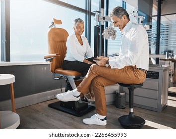 Eye doctor, tablet or senior happy woman consulting for help with eyesight at optometrist or ophthalmologist. Optician talking or asking customer questions to check vision, iris or retina health - Powered by Shutterstock