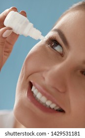 Eye Drop. Woman Applying Lubricant Eye Drops In Her Eyes Closeup. Happy Smiling Girl With Artificial Tears Bottle