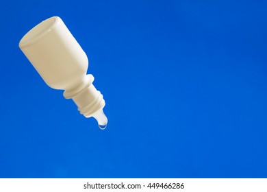 Eye Dropper Bottle With Blue Background