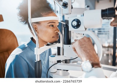 Eye exam or black woman consulting doctor for eyesight at optometrist or ophthalmologist. Face of African customer testing vision with optician helping or testing iris or retina visual health - Powered by Shutterstock