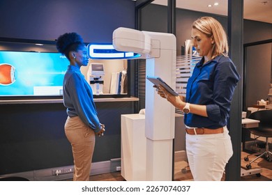 Eye exam, digital machine and optometrist with black woman for eyesight, vision test and optical consulting. Healthcare, ophthalmology and optician with patient and medical tech, monitor and tablet - Powered by Shutterstock