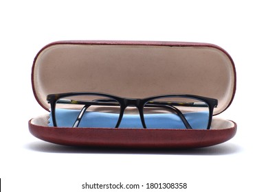 Eye glass frame on brown box on white background.