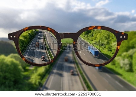Eye glasses against ametropia sharp panorama view over a Highway without of focus photo parts. 