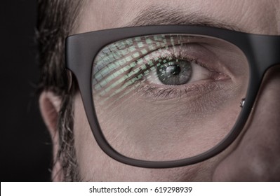 Eye And Glasses - Caucasian Man's Face Close Up (macro). Black Background, Dark Moody Light.