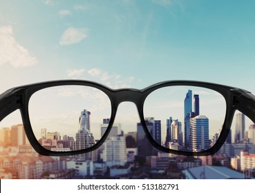 Eye Glasses Looking To City View, Focused On Glasses Lens