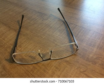 Eye glasses on a table surface
