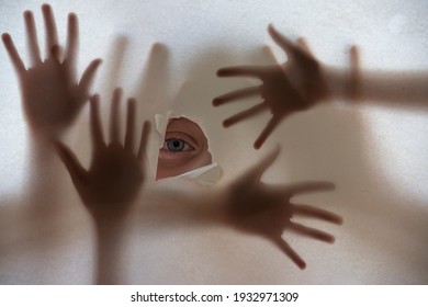 an eye and hands shadows 