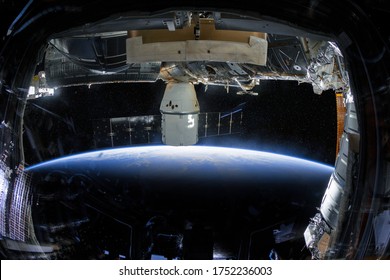 Eye of the hurricane. Typhoon over the planet Earth, view through the porthole of the space station. A category 5 super Typhoon is approaching the coast. (Elements of this image are provided by NASA) - Powered by Shutterstock