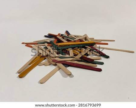 Eye Level View of Multi Colored Wooden Popsicle Sticks Heap
