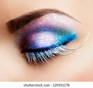 Eye Makeup. Beautiful Eyes Glitter Make-up. Holiday Makeup Detail. False Lashes