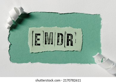 Eye Movement Desensitization and Reprocessing psychotherapy treatment concept. Letters EMDR written on thorn paper in frame. - Shutterstock ID 2170782611