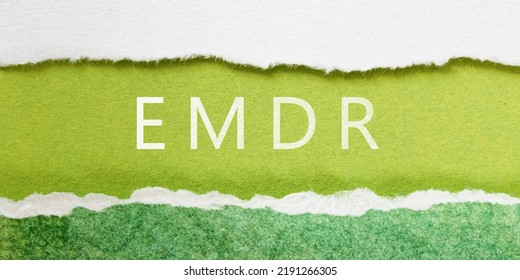 Eye Movement Desensitization and Reprocessing psychotherapy treatment concept. Letters EMDR written on a green torn paper. - Shutterstock ID 2191266305