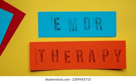 Eye Movement Desensitization and Reprocessing psychotherapy treatment concept. Letters EMDR and therapy written on a paper. - Shutterstock ID 2309455715