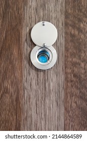 Eye Peephole In Dark Brown Wooden Door