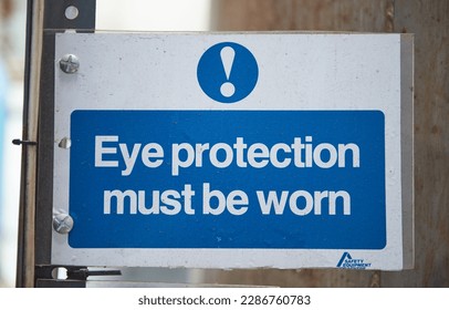 Eye protection must be worn health and safety sign to deny personal with no access clearance. Off limits in an industrial factory. danger ahead, health and safety hazard warning. - Shutterstock ID 2286760783