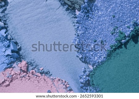 Eye shadow powder multi colored palette set purple blue smudge loose background. Beauty product sample swatch