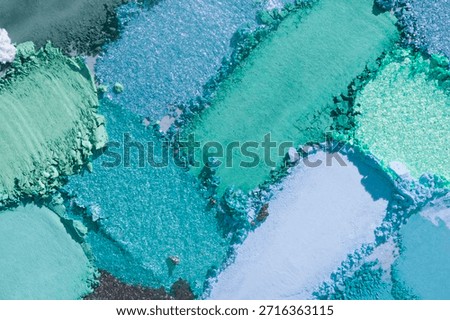 Eye shadow set multicolored blue and pink, green black crushed powder smudged background swatch