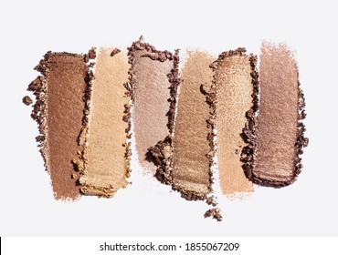 Eye shadow shimmering matte multi colored yellow golden brown nude palette texture background white isolated 