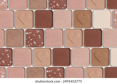 Eye shadows beige color swatches, creative cosmetic texture background, different shiny and matte eyeshadow, trend geometric pattern, aesthetic beauty template, neutral color powder for makeup, above